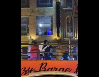 Four men shouts and dances on the party bus