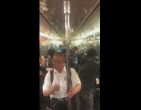 Collab Subway Creatures - Man sings opera and hits handrail with stick while woman behind preaches the Bible on subway train
