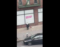 Man in Hoodie Dance on Street with Dog