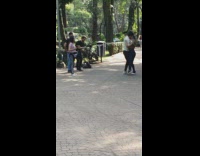 Man and Woman passionate dance video shoot at the park