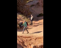 Girl black jacket look upward canyon park