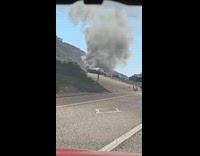 Car on fire huge smoke on highway