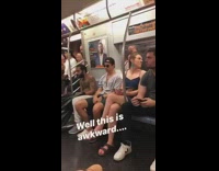 Grey jersey shirtless guy tattoos subway train 