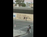 Girl poses by painted harriet tubman quote 