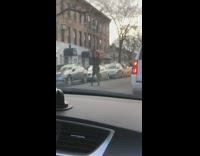 man dancing in middle of street