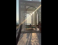 Woman on bed swing at beach resort