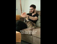Man brushing off fur on clothes 