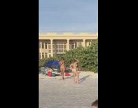 Woman white bikini hand on hair pose beach