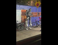 Robot walks outside the door at night 