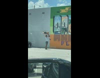 Man lift woman hat fell parking lot
