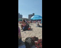 Guy lifts on very busy beach