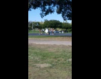 Girl bikini step on basketball park bike