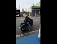 Man on motorcycle fails to do wheelie 