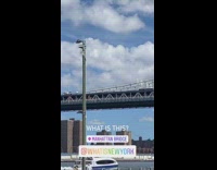 Black striped concrete mixer trucks drive bridge 