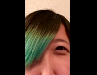 Girl with green black hair covering one eye filter