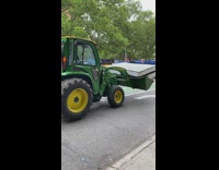 Forklift delivers blue mattress on street 