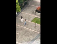 Two women tiktok dance at the park