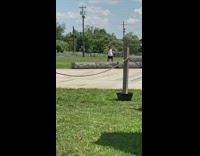 Girl white top  practice cheerleader moves park