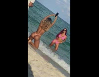 Two women bikini pictorial phone raise up and down