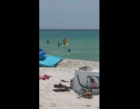 Girl white paddle board blows floats away