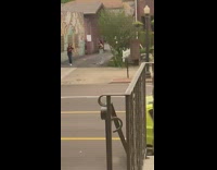 Girl brown shirt beside wall graffiti alley
