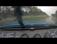 Car Slips and Rolls Over on Expressway