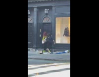 Girl dances barefoot while guy plays guitar