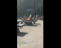 Guy in pool chair crunches ab exercises 