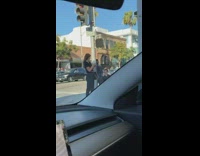 Girl takes photo by street 