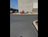 Guy walks outside store 