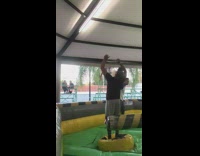 Guy gets hit spinning bar obstacle course 