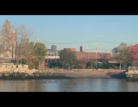 Guy swims with red buoy 