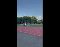 Biker with trashcan on head at track 