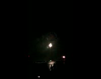 Man shouts with fireworks explodes in sky