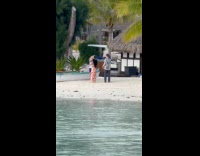 Man and Woman dances for beach video
