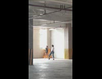 Black dress white hat girl parking structure   