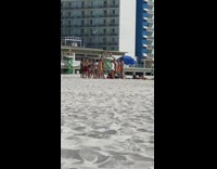 girls in dance circle twerk beach