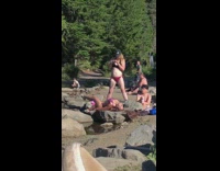 Woman violet bikini bend rock river pictorial