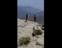 Guy poses on mountain edge 