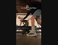 Pilates cable girl over stretched