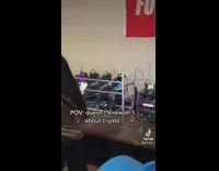 Guy recording a woman recording a cryptocurrency mining farm