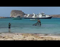 Woman bikini dress sit broken dock beach