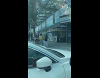 Girl posing under theater sign