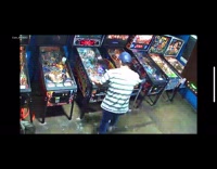 Guy sings music video arcade pinball machine