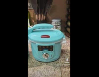 Woman plays with her kids kitchen toys 