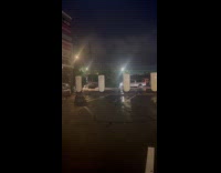 Cars passed by flooded road after storm