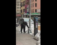 Guy rides skateboard without wheels down snow 