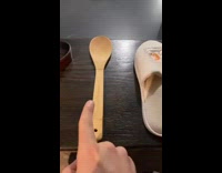 Guy points at slipper spoon and belt 