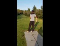 Guy throws disc golf out of target