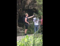 Black backpack guy selfie phone mount hike